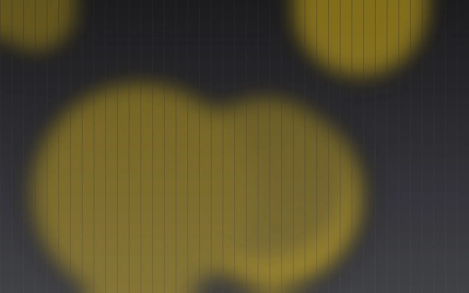Blurred graphite and yellow shapes representing digital campaigns